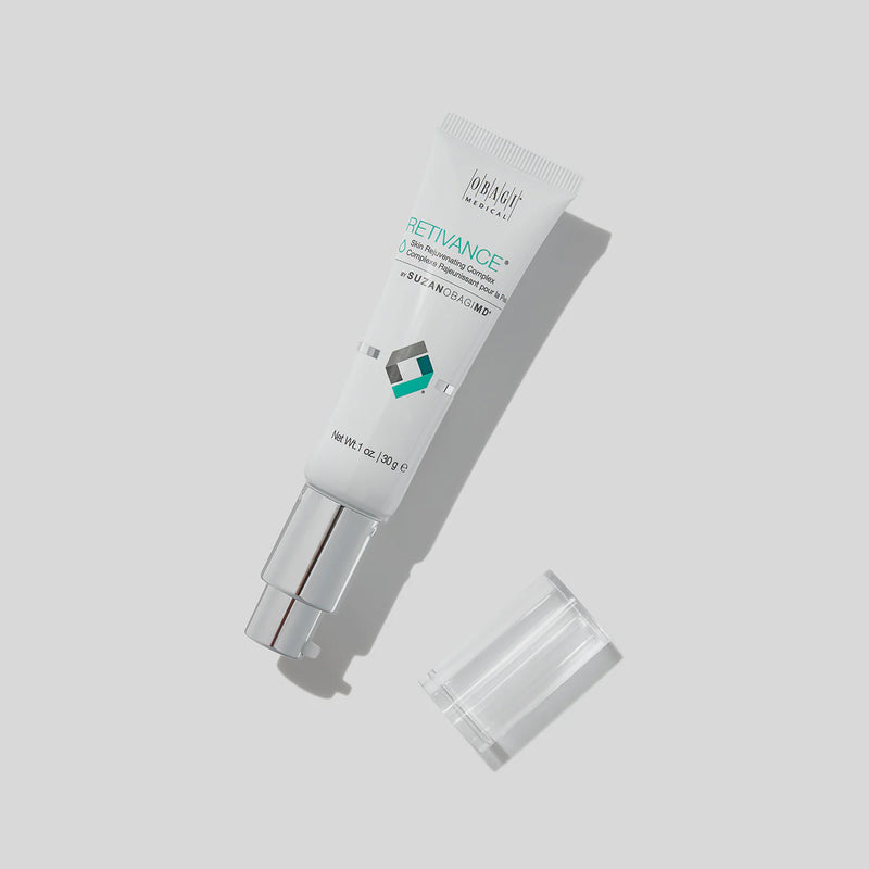 An image of of SUZANOBAGIMD Retivance Skin Rejuvenating Complex where it's cap is removed and is sitting beside the bottle.