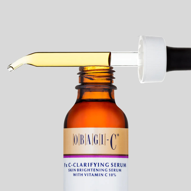 An image of an opened bottle of Obagi-C Fx C-Clarifying Serum with it's dropper sitting on top of the lid.