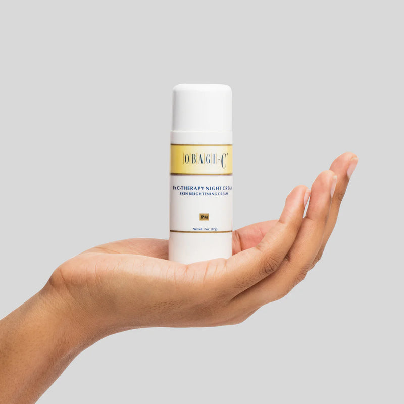 An image of Obagi C-Fx Therapy Night Cream sitting in a palm of a hand.